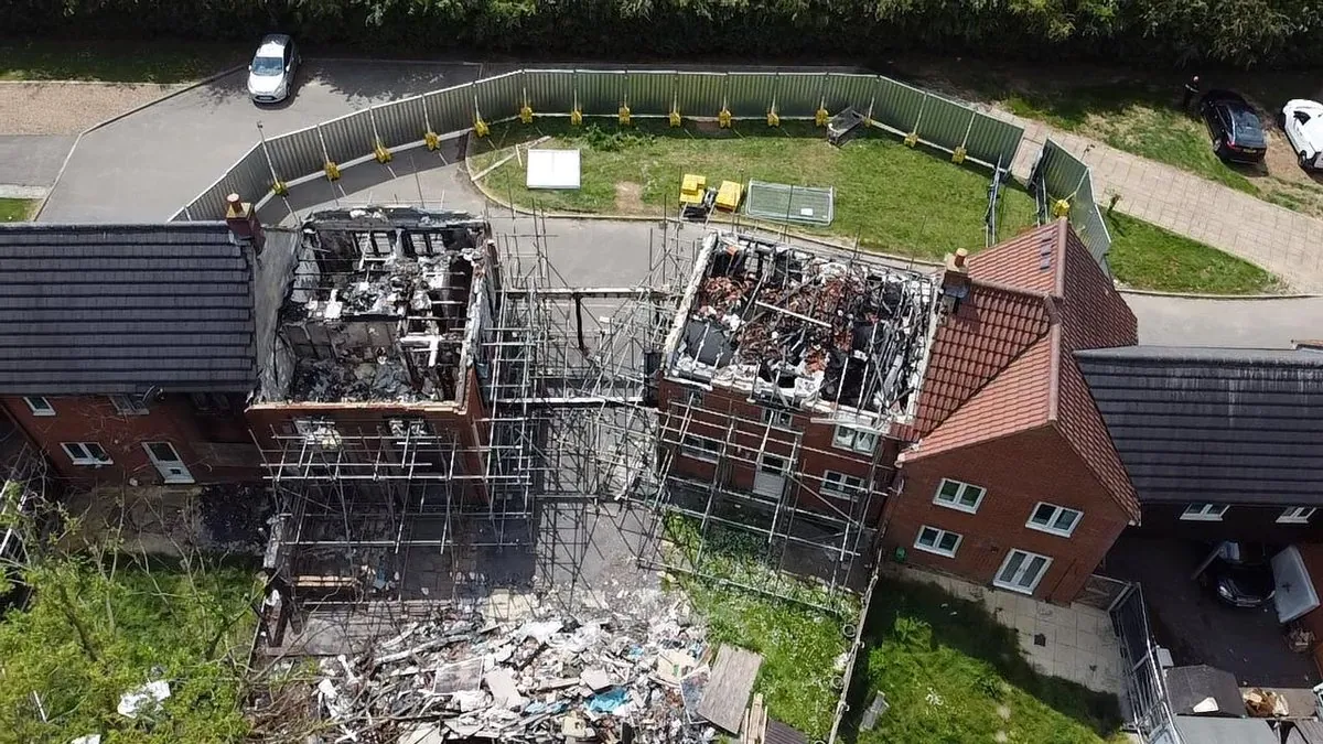 Aerial close-up: fire-damaged roof structure prepared for reinstatement works