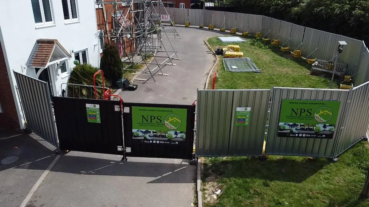 NPS branded site hoarding securing fire-damage reinstatement compound