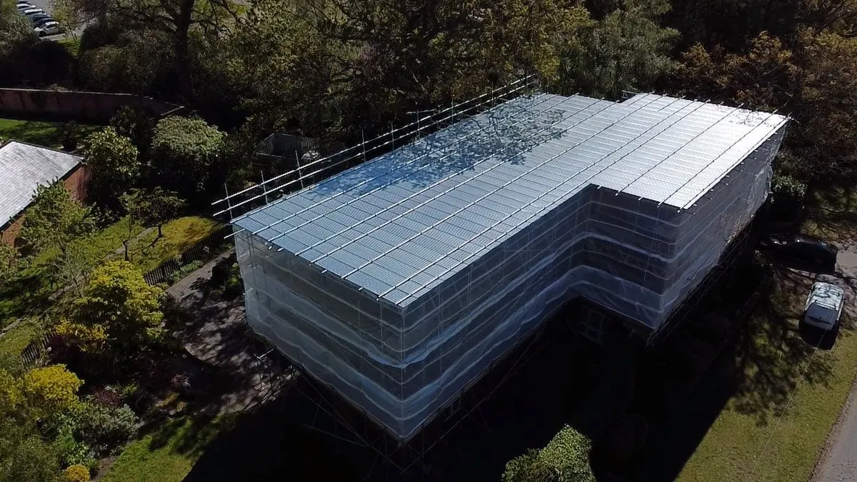 Aerial view: NPS scaffolding and shrink-wrapped roof on major refurbishment